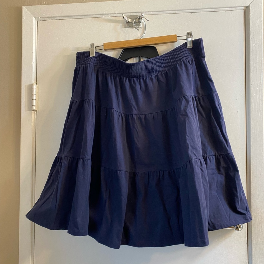 Blue skirt. Very comfy and great for summer.I’m 5’6 fits at knees.